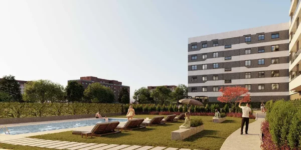 Zona ajardinada de LAUREDAL con piscina, tumbonas, senderos, vegetación y edificios residenciales al fondo — render facilitado por el cliente